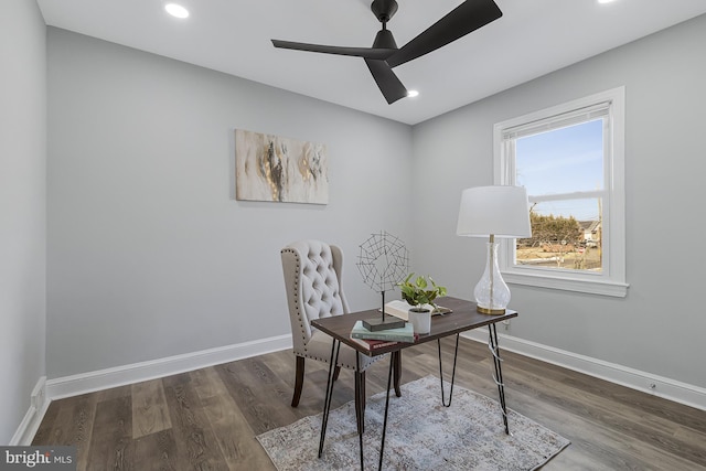 office space featuring dark wood-type flooring and ceiling fan