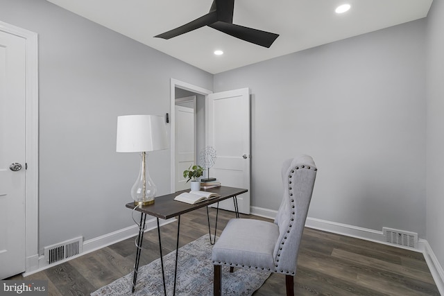 home office with dark hardwood / wood-style floors and ceiling fan