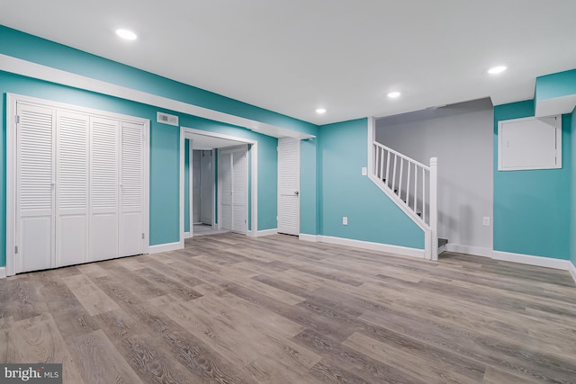 basement featuring light wood-type flooring