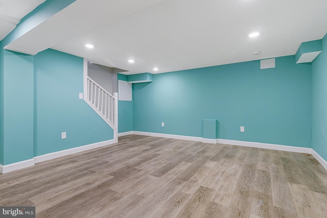 basement featuring light wood-type flooring