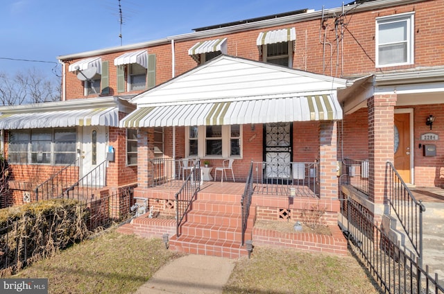 view of property featuring covered porch