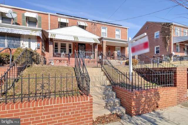 view of front of property featuring covered porch