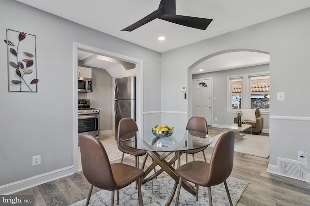 dining area featuring ceiling fan and light wood-type flooring