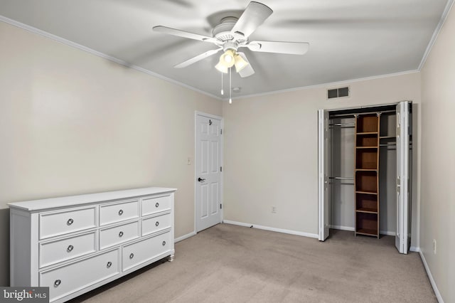 unfurnished bedroom featuring light carpet, ornamental molding, a closet, and ceiling fan