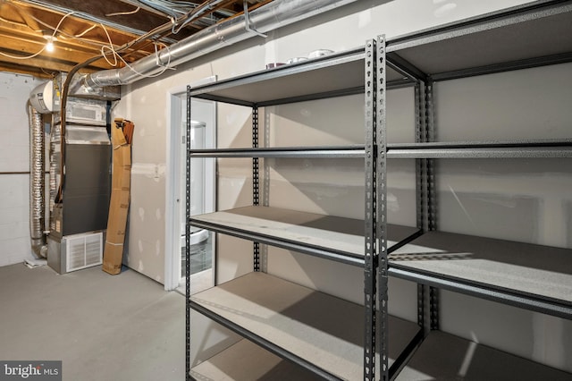 storage room featuring heating unit