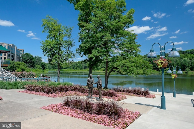 view of community with a water view