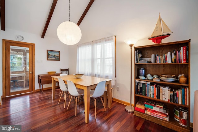 dining area with a healthy amount of sunlight, dark hardwood / wood-style floors, and beam ceiling