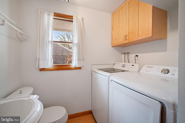 laundry room with washer and clothes dryer and sink