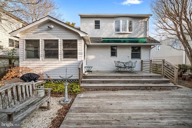 back of house with a wooden deck