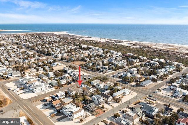 aerial view with a beach view and a water view