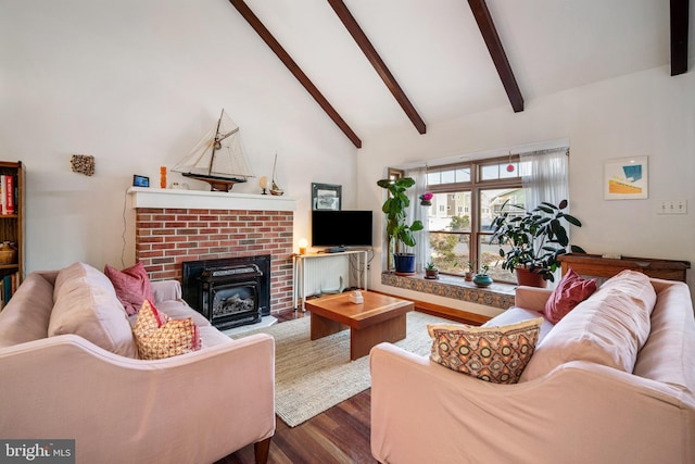 living room with beam ceiling, hardwood / wood-style flooring, a fireplace, and high vaulted ceiling