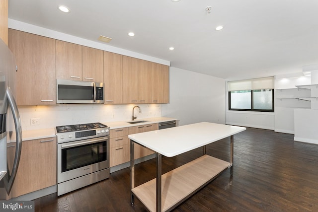 kitchen with sink, appliances with stainless steel finishes, backsplash, dark hardwood / wood-style floors, and light brown cabinets