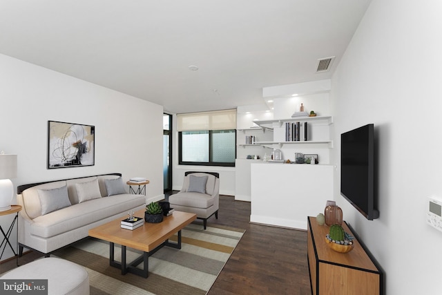 living room with dark hardwood / wood-style flooring