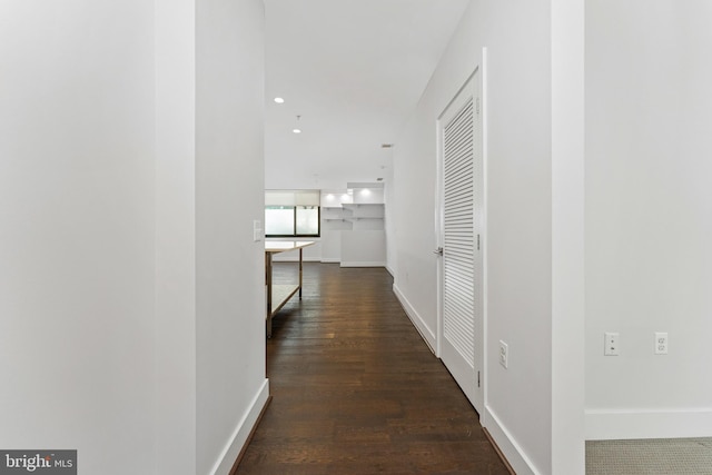 hall with dark hardwood / wood-style floors