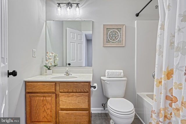 full bathroom featuring tile patterned floors, vanity, toilet, and shower / tub combo with curtain