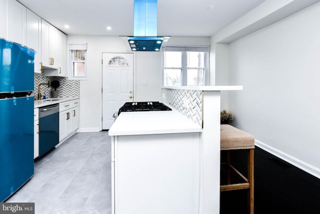 kitchen featuring white cabinetry, stove, fridge, island exhaust hood, and stainless steel dishwasher