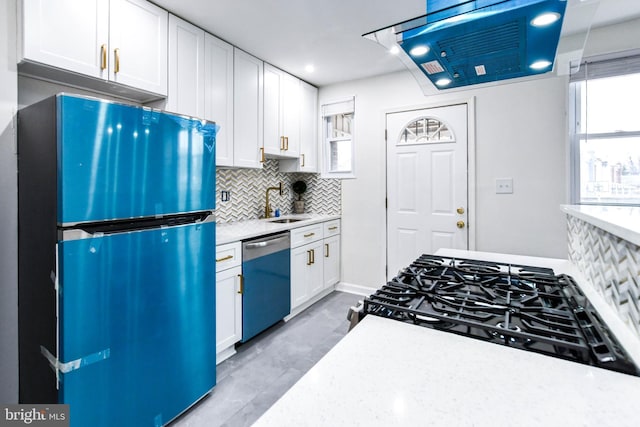 kitchen with fridge, white cabinetry, dishwasher, and decorative backsplash