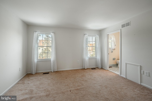 empty room featuring light colored carpet