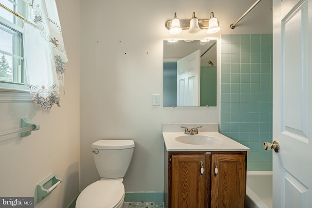 full bathroom with shower / bath combination, vanity, and toilet