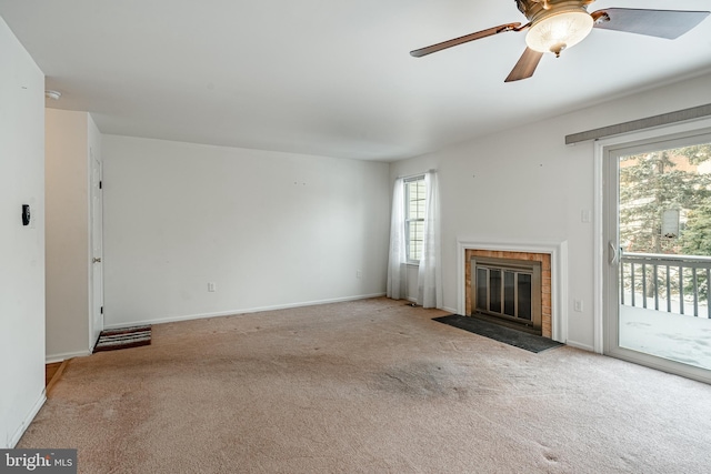 unfurnished living room featuring light colored carpet and ceiling fan