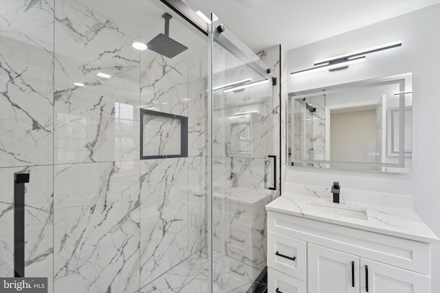 bathroom with vanity and an enclosed shower