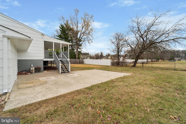 view of yard featuring a patio and cooling unit