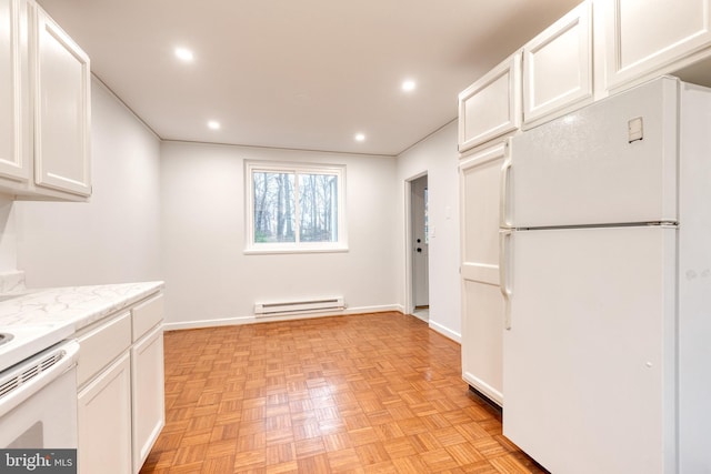 kitchen with white cabinetry, white appliances, a baseboard radiator, and light parquet flooring