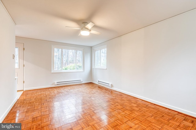 unfurnished room featuring a baseboard heating unit, light parquet floors, and ceiling fan