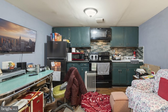 kitchen with tasteful backsplash, radiator heating unit, dark hardwood / wood-style flooring, green cabinets, and black appliances