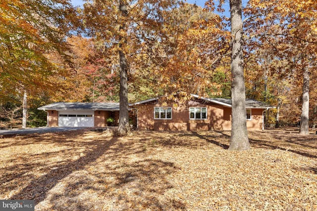 single story home featuring a garage