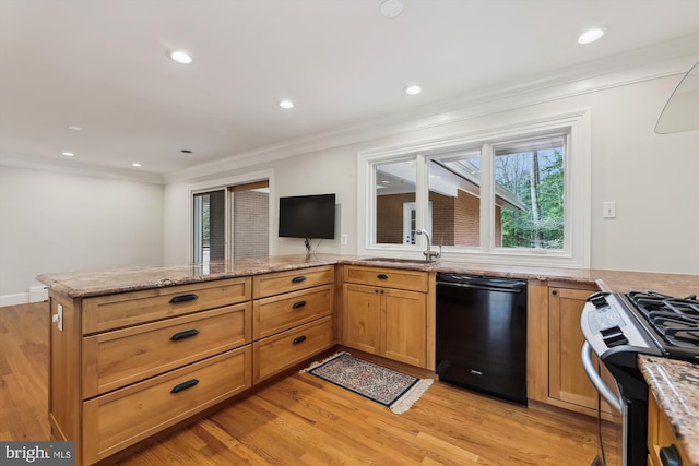 kitchen with sink, stainless steel gas stove, dishwasher, kitchen peninsula, and light hardwood / wood-style floors