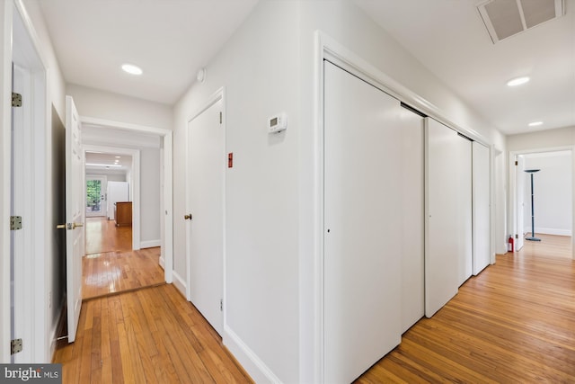 hallway with light wood-type flooring