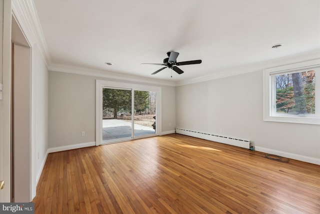 unfurnished room featuring hardwood / wood-style flooring, crown molding, ceiling fan, and baseboard heating