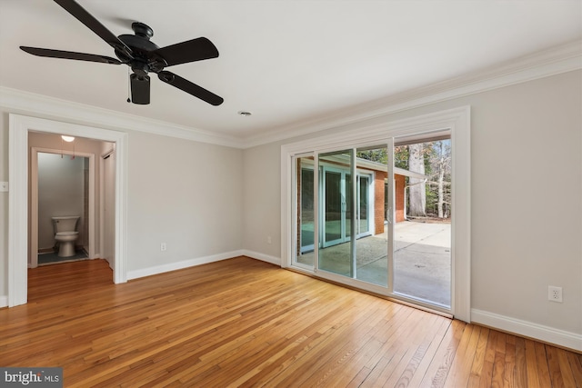 empty room with crown molding and hardwood / wood-style flooring