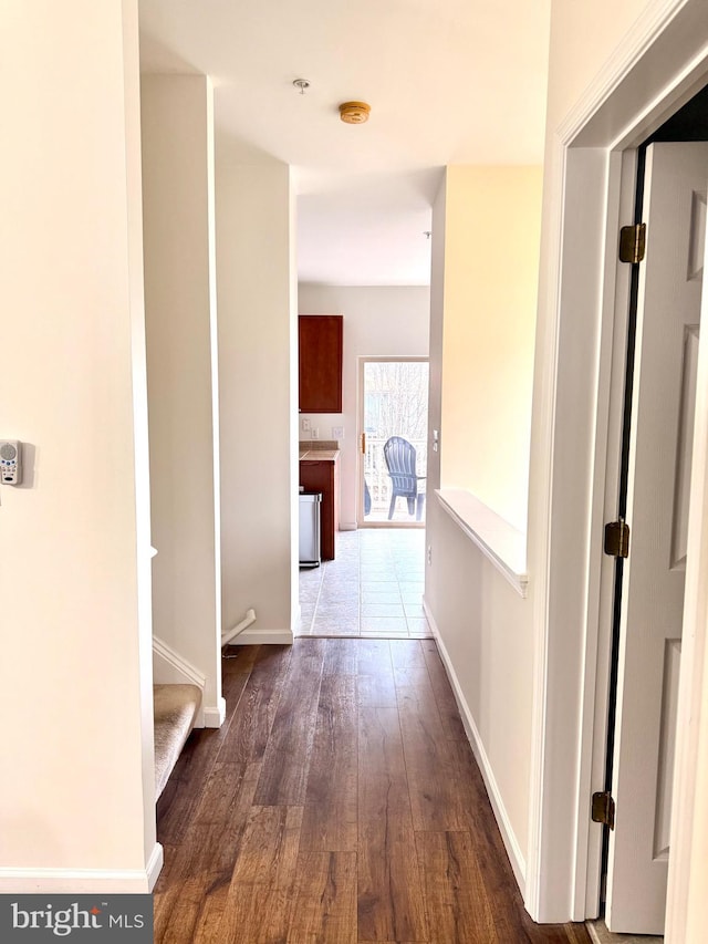 hallway featuring dark hardwood / wood-style flooring