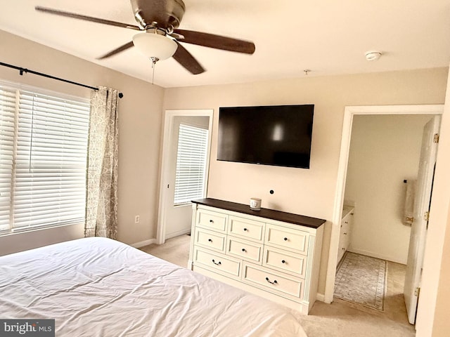 unfurnished bedroom featuring light carpet and ceiling fan