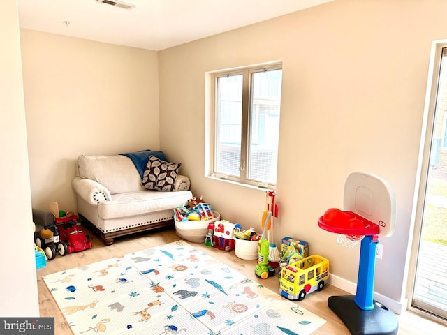 playroom with hardwood / wood-style flooring