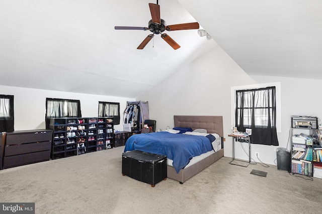 bedroom featuring carpet, lofted ceiling, and ceiling fan