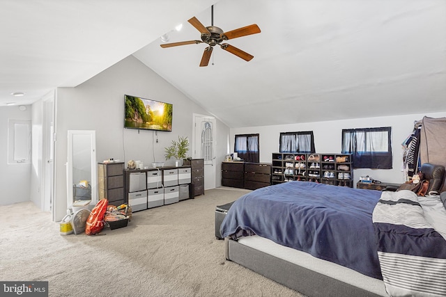 bedroom with ceiling fan, lofted ceiling, and carpet flooring