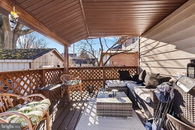 wooden terrace with outdoor lounge area