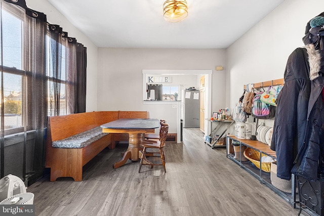 dining space with hardwood / wood-style floors and breakfast area