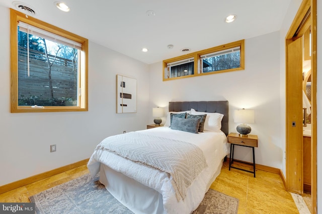 bedroom with recessed lighting and baseboards