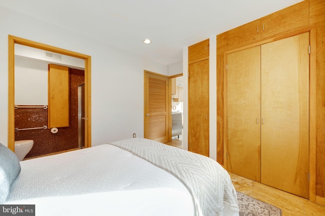 bedroom featuring multiple closets, recessed lighting, and visible vents