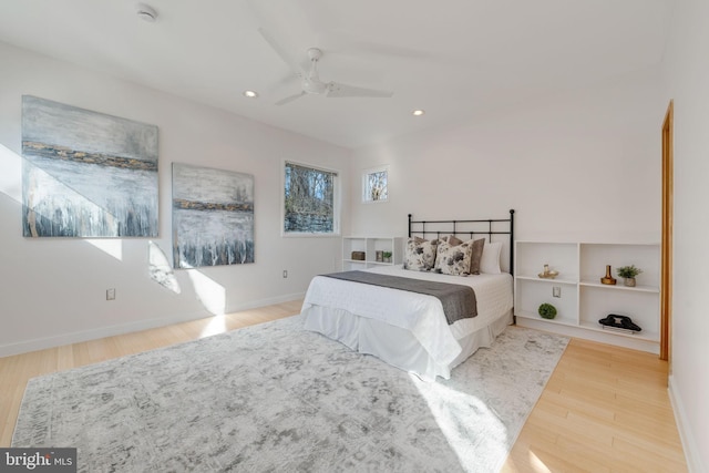 bedroom with light wood-type flooring, ceiling fan, baseboards, and recessed lighting