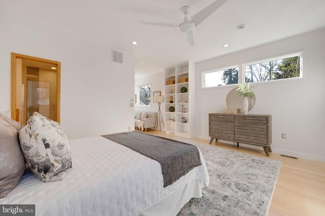 bedroom featuring light wood-style flooring, visible vents, baseboards, and recessed lighting