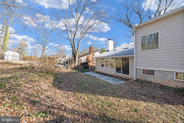 view of yard featuring a patio and fence