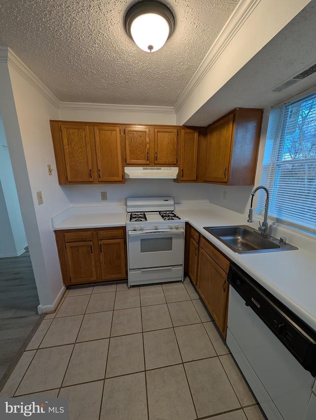 kitchen featuring ornamental molding, white appliances, a sink, and under cabinet range hood