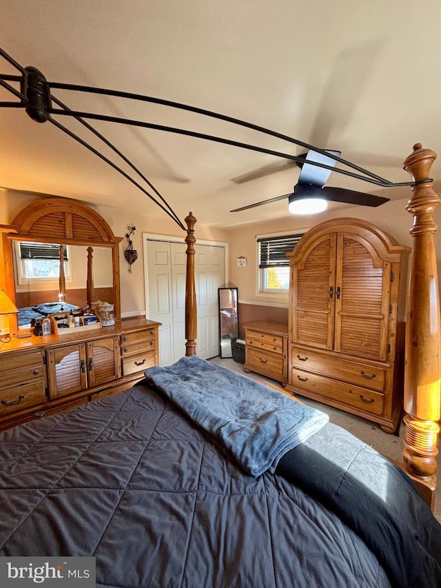 bedroom with a wall mounted air conditioner and carpet flooring