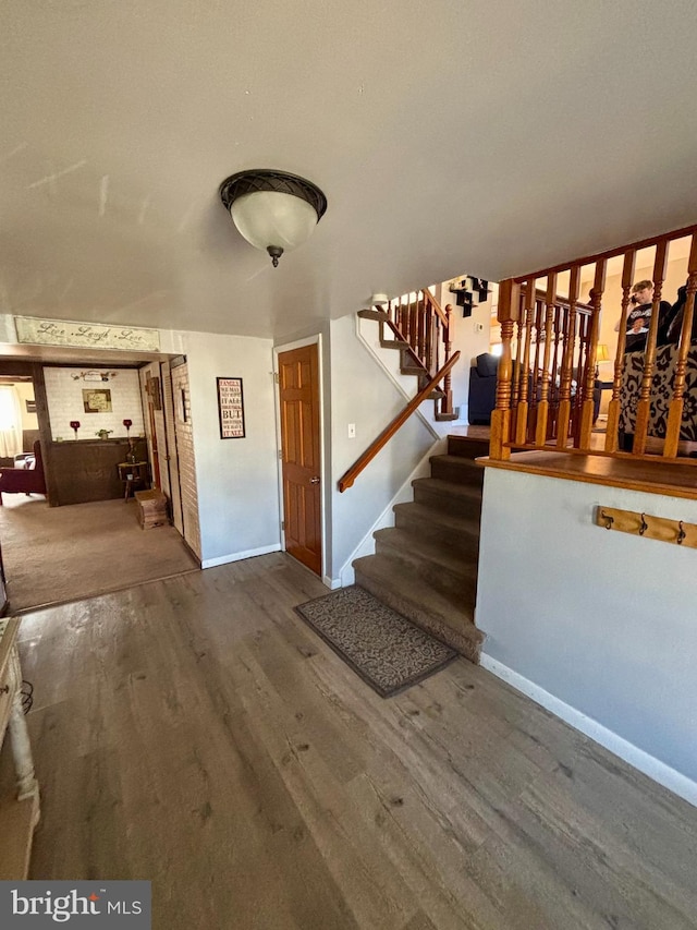 entrance foyer featuring hardwood / wood-style floors