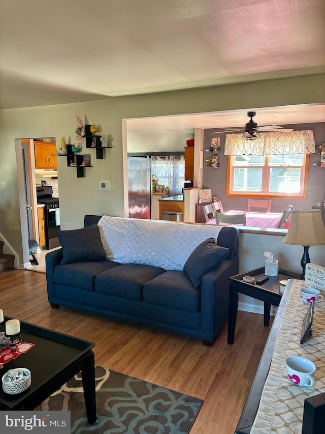 living room with a wealth of natural light and light wood-type flooring